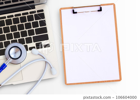 Blue medical stethoscope and laptop computer on white background 106604000