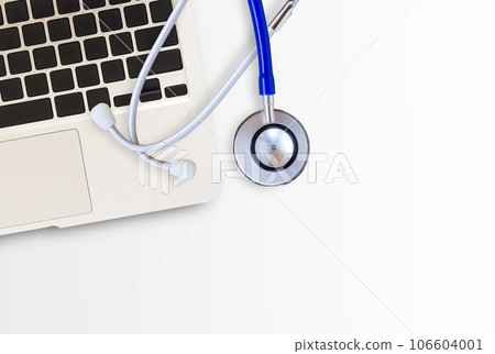 Blue medical stethoscope and laptop computer on white background 106604001