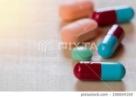 close up pills on wooden close up pills on wooden 106604100