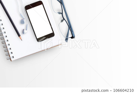 Blank paper notebook and glasses on white table background Blank paper notebook and glasses on white table background 106604210