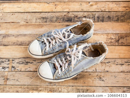 Old shoes on wooden floor Old shoes on wooden floor 106604313