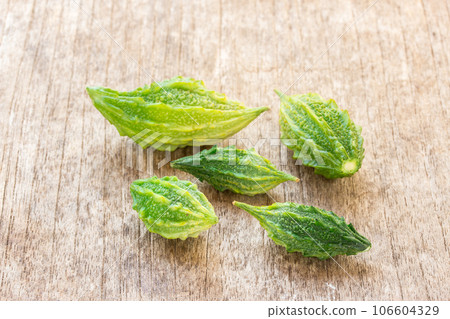 Bitter Cucumber on wooden table 106604329