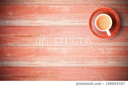 Red coffee cup on old wood background Red coffee cup on old wood background 106604387