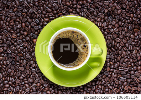 Cup of coffee on beans 106605114