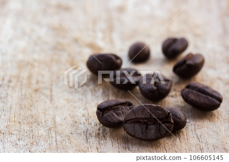 coffee beans on grunge wooden background coffee beans on grunge wooden background 106605145