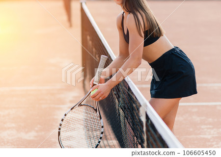 Beautiful stylish sexy woman in black trendy sportswear on tennis court. 106605450
