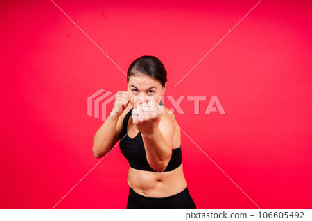 MMA female in sports uniform ready to fight, defense of women from violence 106605492