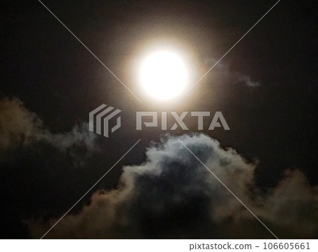 clouds illuminated by the full moon 106605661