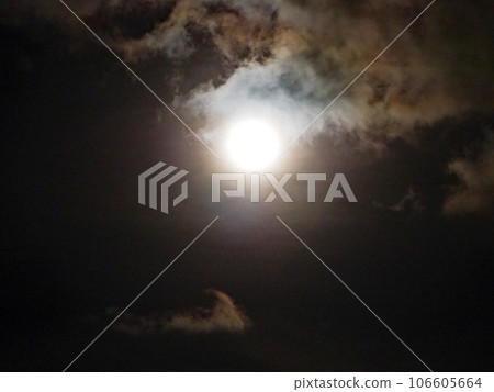 clouds illuminated by the full moon 106605664