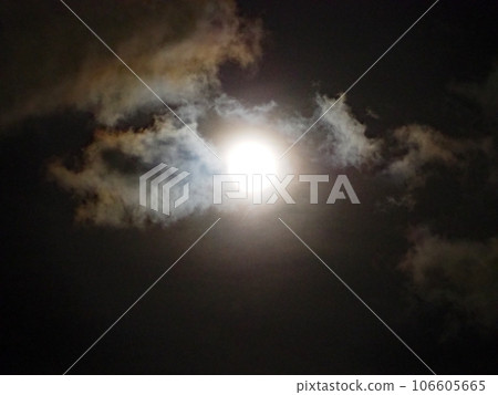 clouds illuminated by the full moon 106605665