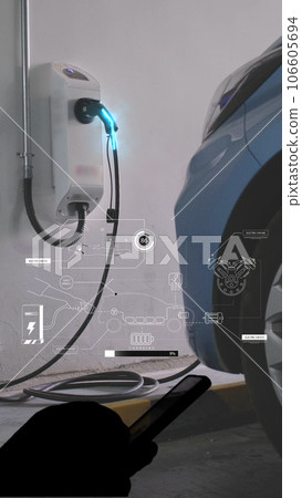 EV charging station for electric car with mobile app display charger status . The electric power is produced from sustainable resources to supply to charger station in order to reduce CO2 emission 106605694