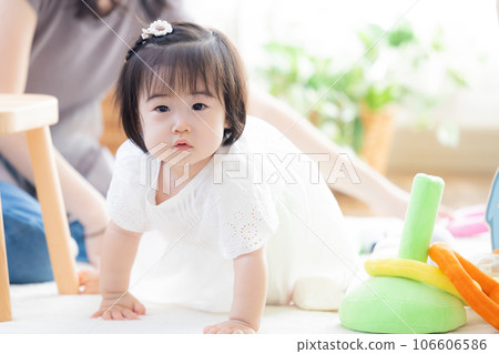 Family girl playing with building blocks Family girl playing with building blocks 106606586