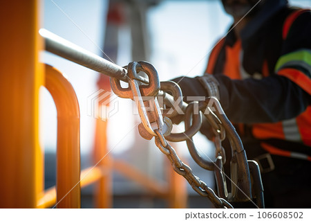 Construction Worker Wearing Safety Harness and Safety Line Masterfully Working at High Place. created with Generative AI 106608502