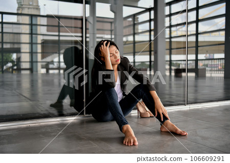 Asian businesswoman is stressed in the city. She is feeling depressed about her bankrupt life. Asian businesswoman is stressed in the city. She is feeling depressed about her bankrupt life. 106609291