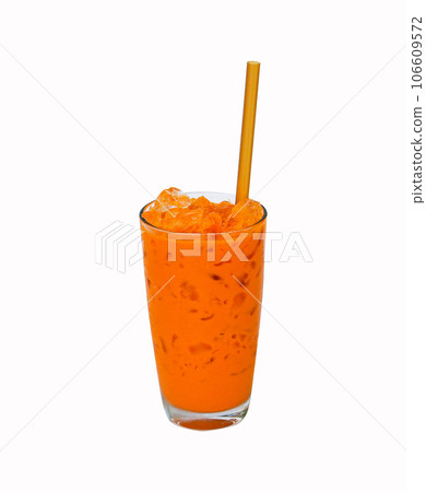 Iced milk tea color orange with crushed ice in glass on tall with straw brown fragrant sweet. isolated on white background. Old-fashioned tea, popular in Thailand around world. Iced milk tea color orange with crushed ice in glass on tall with straw brown fragrant sweet. isolated on white background. Old-fashioned tea, popular in Thailand around world. 106609572
