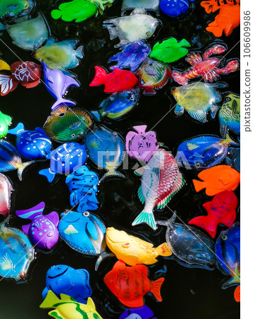 Many children's toy colorful fish in the water. 106609986