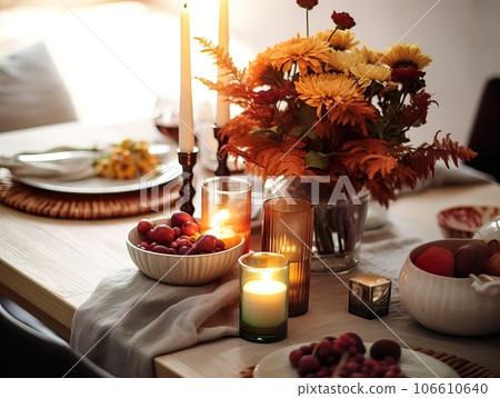 Beautiful fall table setting, autumn dinner table decoration with flowers and candles, holiday event decor in orange and yellow colors Beautiful fall table setting, autumn dinner table decoration with flowers and candles, holiday event decor in orange and yellow colors 106610640