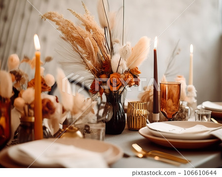 Beautiful fall table setting, autumn dinner table decoration with flowers and candles, holiday event decor in orange and yellow colors Beautiful fall table setting, autumn dinner table decoration with flowers and candles, holiday event decor in orange and yellow colors 106610644