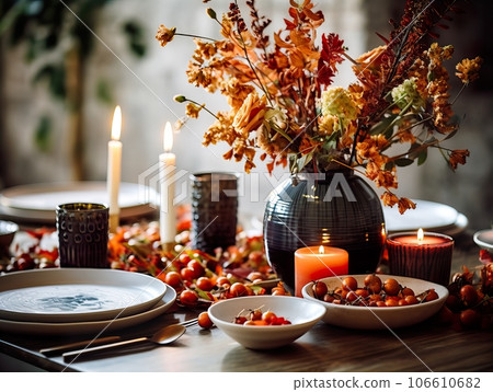 Beautiful fall table setting, autumn dinner table decoration with flowers and candles, holiday event decor in orange and yellow colors Beautiful fall table setting, autumn dinner table decoration with flowers and candles, holiday event decor in orange and yellow colors 106610682