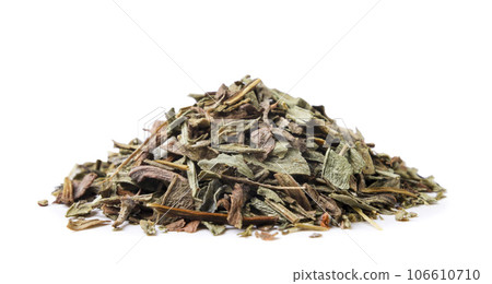 Pile of dried tarragon close-up on a white background. Isolated 106610710