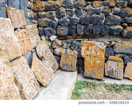 Khachkars along walls of shurch in Sevanavank 106610814