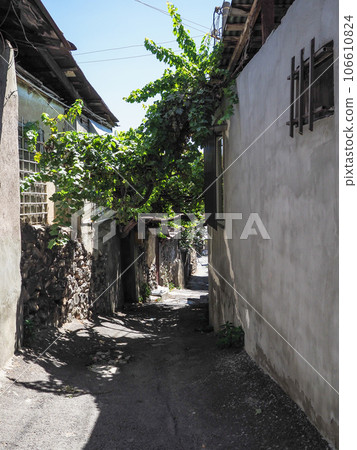 old narrow stone street between houses in Yerevan old narrow stone street between houses in Yerevan 106610824