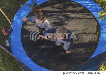 children jump on the trampoline 106611613