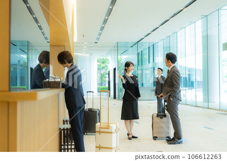 A businessman at the reception desk in the lobby 106612263