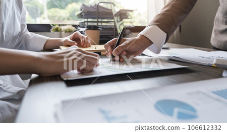 Close up of business team analysis chart and graph showing change and growth on the finance and marketing Close up of business team analysis chart and graph showing change and growth on the finance and marketing 106612332