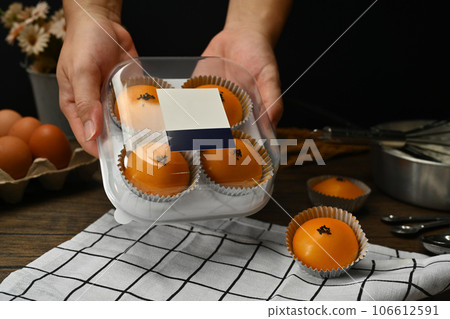 Traditional dessert for Chinese Mid-Autumn festival. Chinese pastry with stuffed salted yolk on wooden kitchen table Traditional dessert for Chinese Mid-Autumn festival. Chinese pastry with stuffed salted yolk on wooden kitchen table 106612591