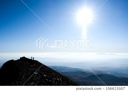 Silhouette of hikers on mountain top Silhouette of hikers on mountain top 106615087