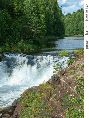 natural landscape with a clear waterfall on a forest river 106616132
