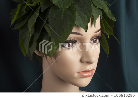 a display mannequin wearing hair of leaves 106616290