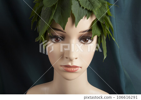 a display mannequin wearing hair of leaves 106616291