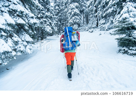tourist with equipment for spending night in winter mountains 106616719