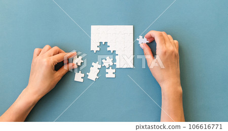 Hands with Small white square puzzle 106616771