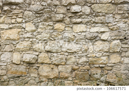 Texture of stone wall with many big brown stones 106617571