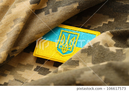 Military camouflage fabric with ukrainian flag on uniform chevron 106617573