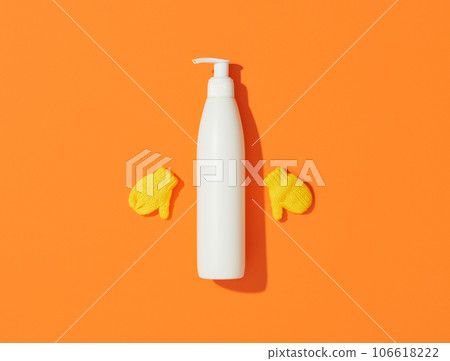 Blank white cosmetic bottle on orange background 106618222
