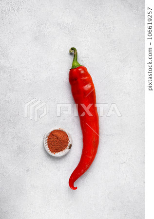 Red sweet bell peppers on table and paprika, top view 106619257