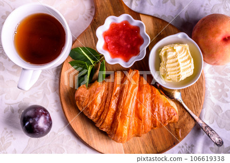 Croissant with tea and jam for breakfast Croissant with tea and jam for breakfast 106619338
