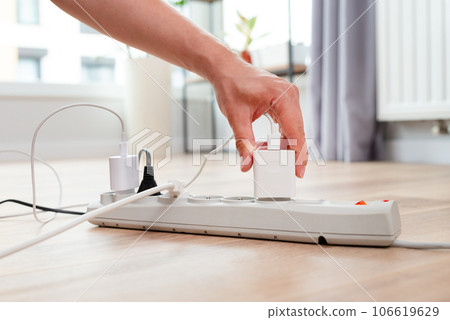 Electrical plug in outlet socket at home Electrical plug in outlet socket at home 106619629