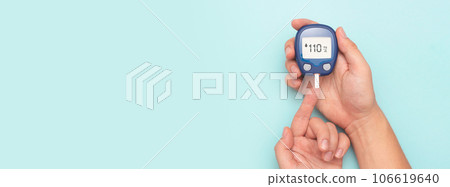 Man using glucometer, checking blood sugar level. 106619640