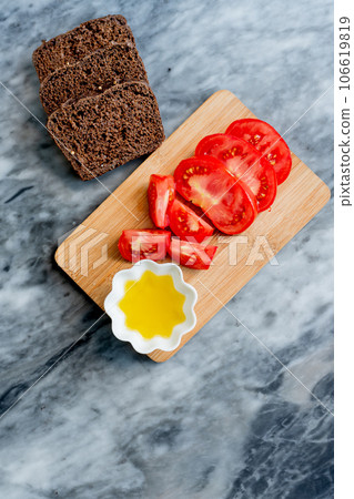 Tomatoes, bread and olive oil. 106619819