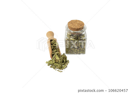Dried leaves o Lemon verbena in latin Aloysia citrodora in wooden scoop and glass jar on isolated on white background. Medicinal herb. Dried leaves o Lemon verbena in latin Aloysia citrodora in wooden scoop and glass jar on isolated on white background. Medicinal herb. 106620457