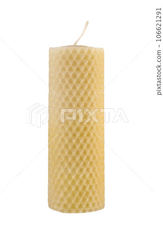 Front view of yellow beeswax honeycomb candle isolated on white background with clipping path 106621291