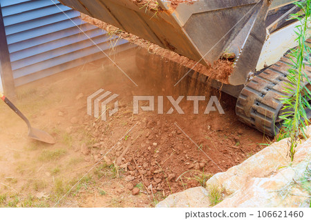 Mini bulldozer role in landscaping works encompasses earth moving tasks, where it adeptly maneuvers transports soi Mini bulldozer role in landscaping works encompasses earth moving tasks, where it adeptly maneuvers transports soi 106621460
