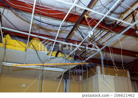 Dismantling of old ceiling is integrated into ceiling works during interior building complex reconstruction. Dismantling of old ceiling is integrated into ceiling works during interior building complex reconstruction. 106621462