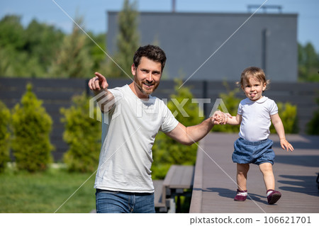 Happy young father and his little son on the walk 106621701