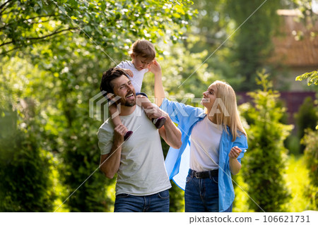 Parents and their cure kid spending time in the park Parents and their cure kid spending time in the park 106621731